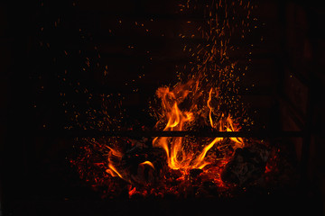 Fire and sparks in the fireplace. long exposure. The texture of fire. Background
