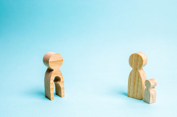 Figure of a man with an empty form in the form of a child and a child. Concept of mother and child,...