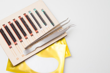 Eyelash Extension Procedure. tools for eyelash extension. glue, tweezers. Focus on lashes - Beauty and fashion concept