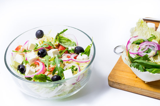 Cooked salad and vegetables on the board. Cutting board and vegetables.