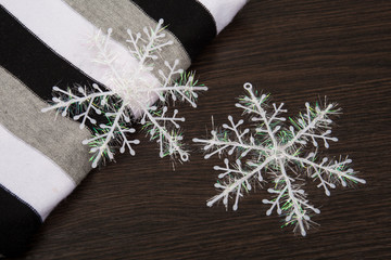 The fabric is black and white. Wool fabric. Snowflakes.