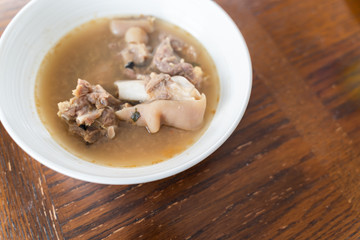 Nigerian Goat Meat Pepper soup served in a white bowl
