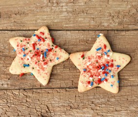 Two star shaped cookies with sprinkles