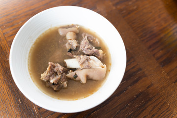 Nigerian Goat Meat Pepper soup served in a white bowl