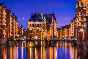The Warehouse District (Speicherstadt) in Hamburg, Germany, at night. View of Wandrahmsfleet. The largest warehouse district in the world is located in the port of Hamburg in the HafenCity quarter. © foto-select