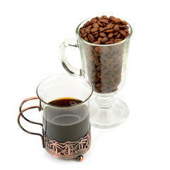 coffee in a delicate glass and coffee beans isolated on white background.