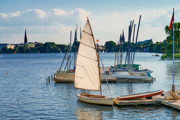 The lake Alster in Hamburg, Germany, with sailboats in the evening. The Außenalster (Outer Alster) serves as important recreational area in the heart of the city.