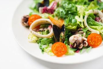 seafood salad on the white plate