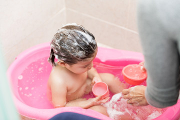 Woman Taking Care Of Daughter's Hygiene