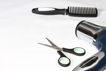 comb with scissors in a hair salon
