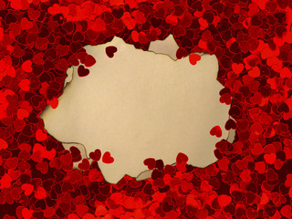 Scarlet hearts and old burnt paper for notes, template, space for text. Valentine day concept. Top view red background