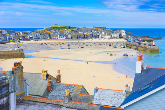 St. Ives, Cornwall, England, UK in the summer. View of the harbor at low tide.