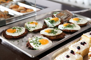 Trays with healthy food in school canteen