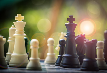 Black and White King and Knight of chess battle on board . Black king are leader to fight with...