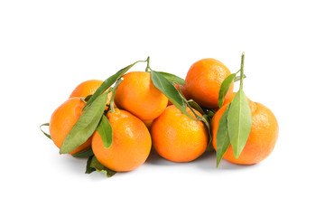 Tasty ripe tangerines with leaves on white background