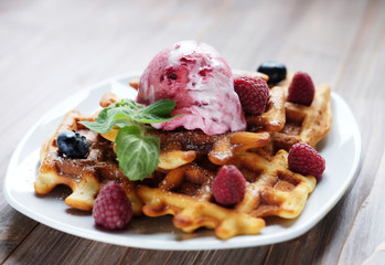 Belgian waffles with fresh berries and ice cream 