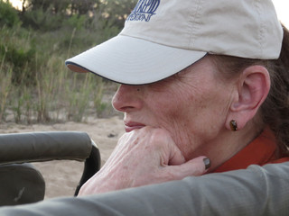 Woman on safari, fascinated by the animals
