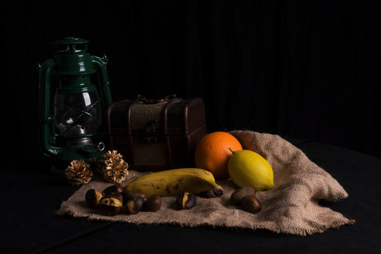 Still life with fruits and vegetables on black background, isolated
