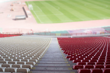 Obraz premium red and white seats at the stadium