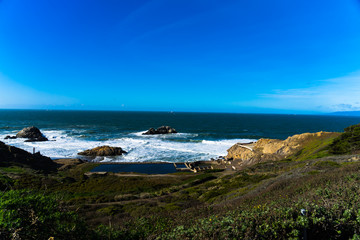 The view of Lands end at San Francisco- San Francisco. summer , cloud , rock , sea, plant.