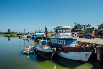Fototapeta na wymiar Boats and small ships in harbor