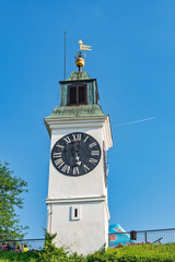 Fototapeta premium Novi Sad, Serbia - May 27, 2018: Clocktower of the Petrovaradin fortress in Novi Sad, Serbia.