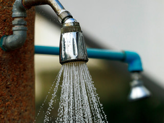 Water flows out of the old shower.