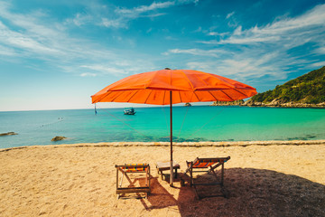 Beach chair with umbrella in seashore