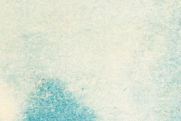 Abstract blue background. Blank vintage cardboard and paper backdrop. The texture of the surface of the old cardboard with blue stains. 