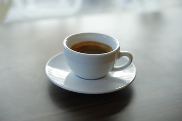 Fototapeta premium Hot coffee on wood background..