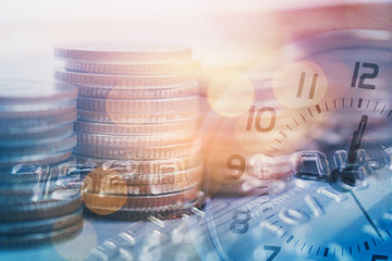 Double exposure of clock and rows of coins with credit card for finance and business concept