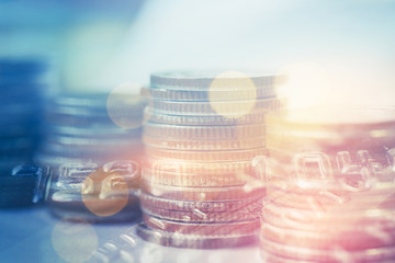 double exposure of row of coins and credit card  for business and finance background