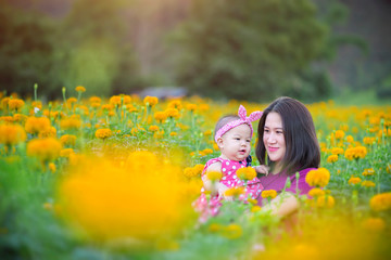 Naklejka premium Young Mother holding baby girl in her arms