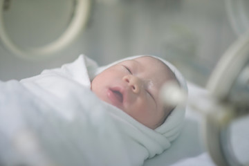 Fototapeta na wymiar Little Newborn baby in hospital
