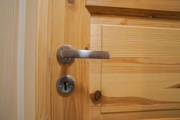 door key and handle of wooden door for lock and access