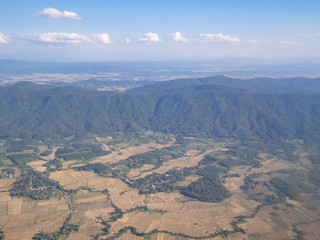 Beautiful landscape with mountains covered with green forest. Bird's-eye view.