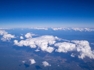 Fototapeta na wymiar Blue sky clouds seen from airplane beautiful with blue sky background nature.