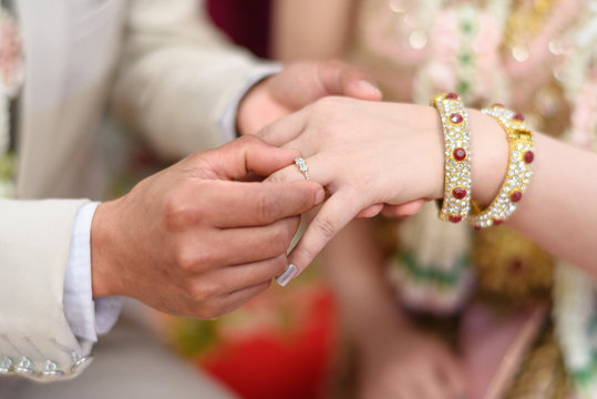 The image of a wedding couple wearing a wedding ring.