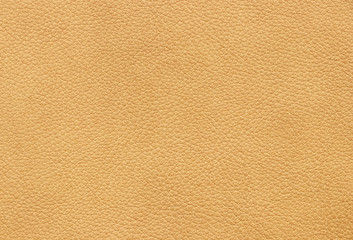 The texture of genuine leather beige colour. Material of animal origin. Close-up.