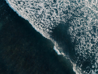 Aerial view beautiful of sea waves from drone. Stock image picture of blue color ocean water, wave, sea surface. Top view on turquoise waves, clear water surface texture. Top view, amazing nature