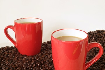 Two cups of coffee on white background.