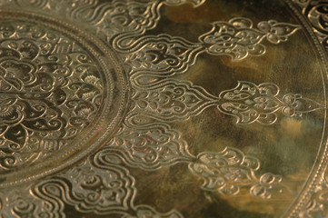 Eastern engraving on bronze, close-up