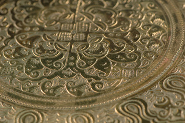 Eastern engraving on bronze, close-up