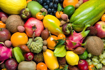 Exotic tropical fruits heap, healthy food, diet nutrition, vegetarian background
