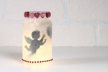 Diy Fairy Jar on white brick wall background. Gift ideas, decor St February 14, Valentines Day, love