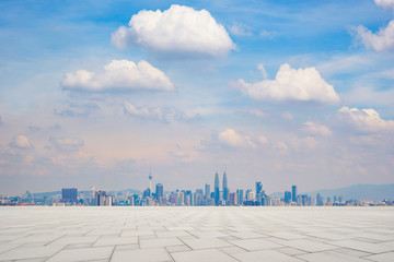 Perspective empty marble floor in front of city skyline background