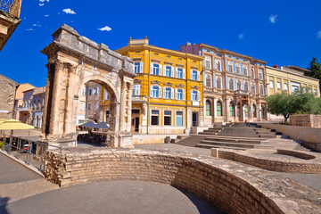 Square in Pula with historic Roman Golden gate view