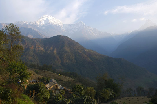 Snowy peaks and forest hills. Trekking to Annapurna Base Camp