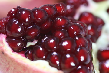 Pomegranate Slice Fruit. Close up Granate Seeds in slice. Macro photo. vitamine and Healthy concept.