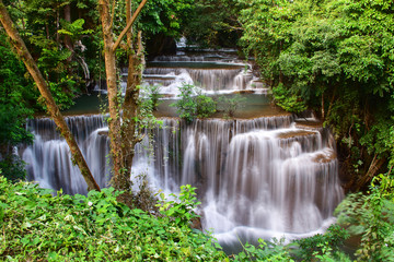 Naklejka na ściany i meble Beautiful waterfall in wonderful rain forest of national park, Huay Mae Khamin waterfall, Kanchanaburi Province, Thailand
